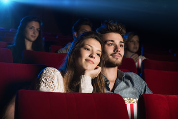Young loving couple at the cinema