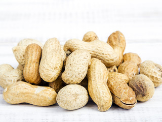 peanuts on a white wooden background