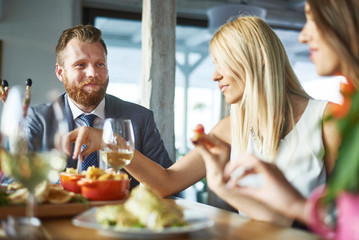 business people meeting in modern restaurant, colleagues having dinner and take drink after work
