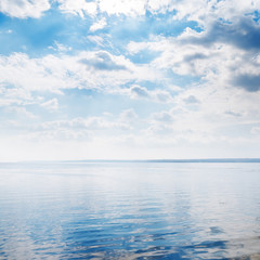 river closeup and clouds over it