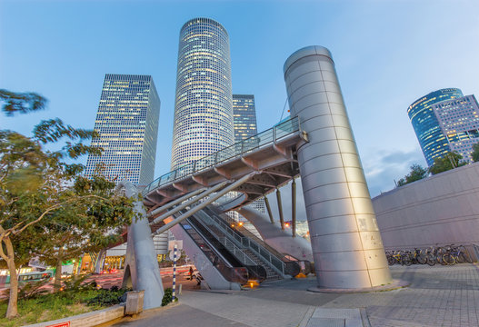 TEL AVIV, ISRAEL - MARCH 2, 2015: The skyscrapers of Azrieli Center in evening dusk by Moore Yaski Sivan Architects with measuring 187 m (614 ft) in height.
