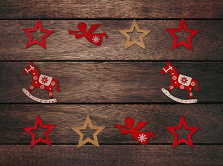 Christmas frame on a wooden background (Christmas decoration over wooden background )
