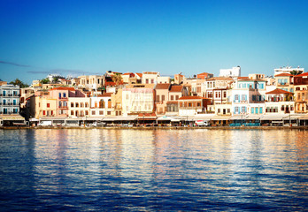 Fototapeta na wymiar waterfront of Chania bay at sunny summer day, Crete, Greece, retro toned