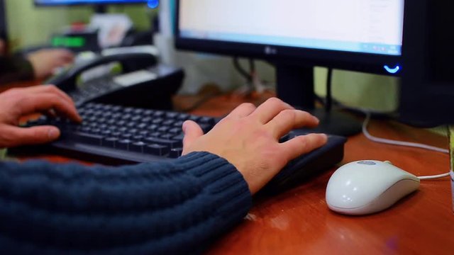 Man hands typing on a laptop keyboard