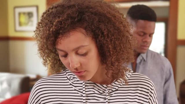 Young black couple having relationship problems. African American man and woman sad 