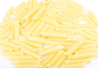 uncooked macaroni with white background