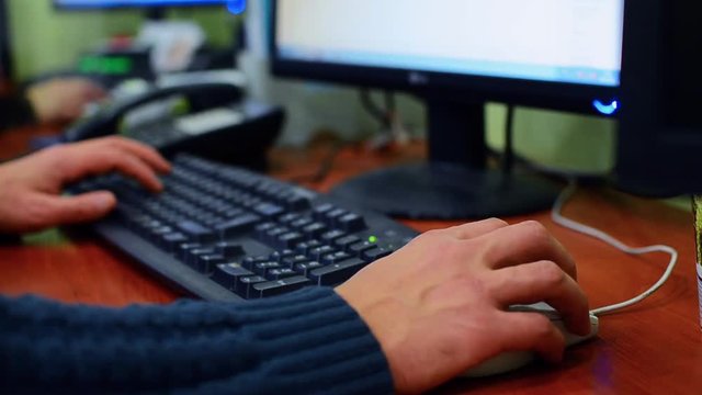 Man hands typing on a laptop keyboard