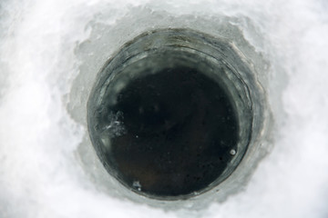 ice screws, shovel, fishing rods, ice fishing near the hole © vitec40