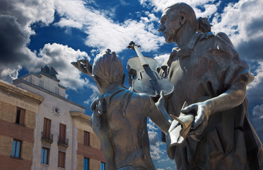 CREMONA, ITALY - MAY 24, 2016: The bronze statue of Antonio Stradivari by Floriano Bodini (1933 -...