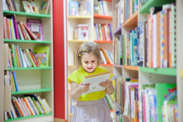 little girl in   children's library.