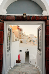 Panorama of Fira, Santorini seen through an open door
