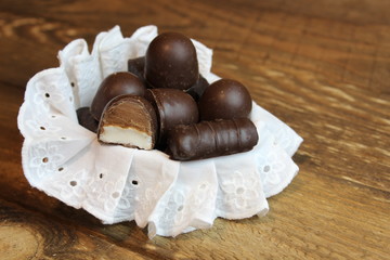 Chocolate candy on a wooden board