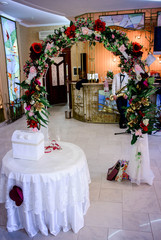 beautiful arch with red flowers for wedding ceremony