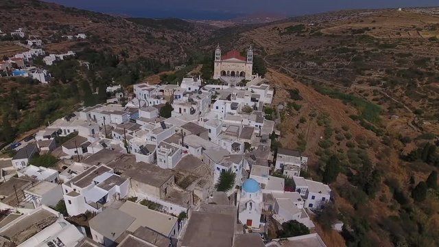 Aerial footage of beautiful, historic village of Lefkes, built on mountain slope on Greek island of Paros.
