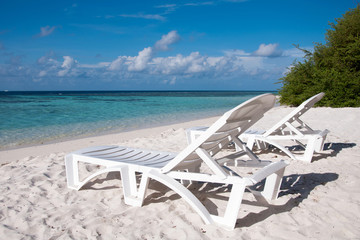 Sunbed at tropical beach, island Thinadhoo, Maldives