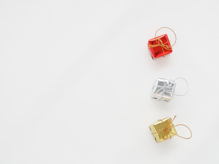 Red, silver, and gold gift boxes on isolated white background