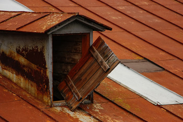 Close-up old decorative vintage attic with dormer on the rustic
