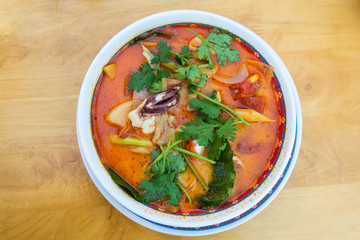 Spicy lemongrass soup with seafood in bowl