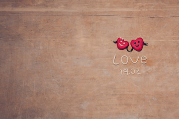 red valentines day hearts on wooden background;