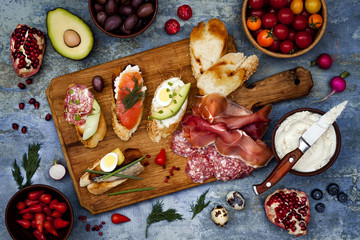 Brushetta or authentic traditional spanish tapas set for lunch table. Sharing antipasti on party or...