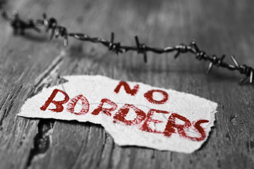 barbed wire and text no borders