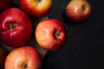 Fresh organic apples on a black background
