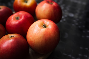 Fresh organic apples on a black background
