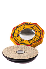 feng shui mirror and compass isolated on white background