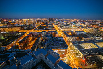 Evening cityscape from rooftop. Houses, night lights, city center. Voronezh 