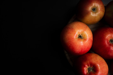 Fresh organic apples on a black background
