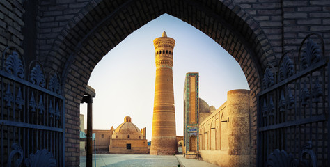 Yard of Poi Kalyan oriental complex at sunset. View from the gate. Bukhara, Uzbekistan - obrazy, fototapety, plakaty