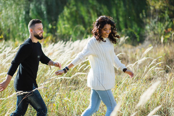 Couple in love - Beginning of a Love Story. A man and a girl on the nature while walking