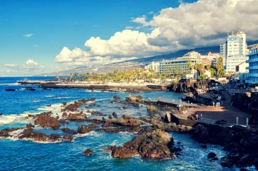 Zelfklevend Fotobehang Coastal promenade in Puerto de la Cruz. Ocean bay and volcanic rocks in the water. Tenerife, Canary islands, Spain. © Betelgejze