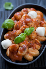Closeup of gnocchi alla Sorrentina, selective focus, studio shot