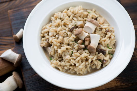Closeup of a white plate with porcini risotto, selective focus