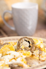 Fried mushrooms in fried eggs