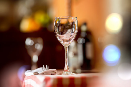 Closeup image of empty wine glass at restaurant background