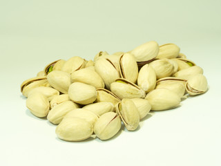 Pistachio nuts on a white background