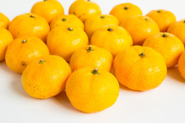 Group of mandarin orange (Citrus reticulata) on white background