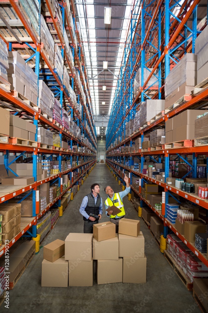 Poster view of managers are looking up and pointing shelves
