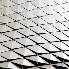 Abstract close-up view of modern aluminum ventilated triangles on facade