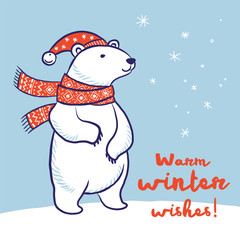 Christmas card of polar bear in red scarf and hat