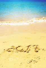 2017 new year on the beach by sea side, retro toned