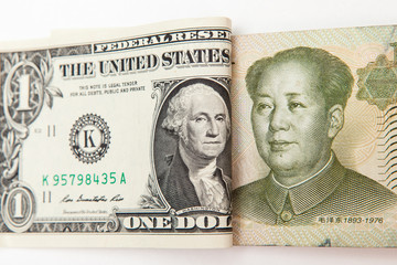 dollar and yuan currency on white background.