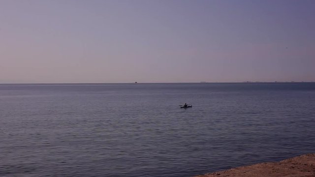 TRIESTE, ITALY - NOVEMBER, 04: Kayaker rowing in the adriatic sea on November 04, 2016