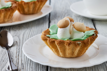 Air cake in a basket on a wooden background