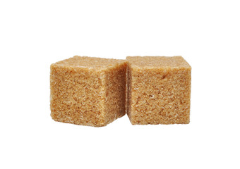 Brown cane sugar cubes isolated on white background