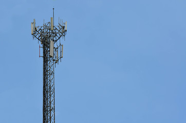 Telecommunication tower against blue sky