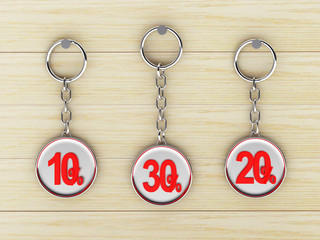 Fototapeta na wymiar Set of silver keychains with red 10,20,30 percentages discount on wooden background. 3D illustration 