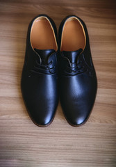 Men's shoes on wooden background